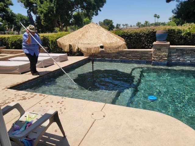 Pool cleaning in action